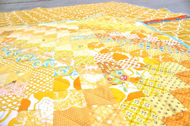 all-yellow scrappy postage stamp quilt