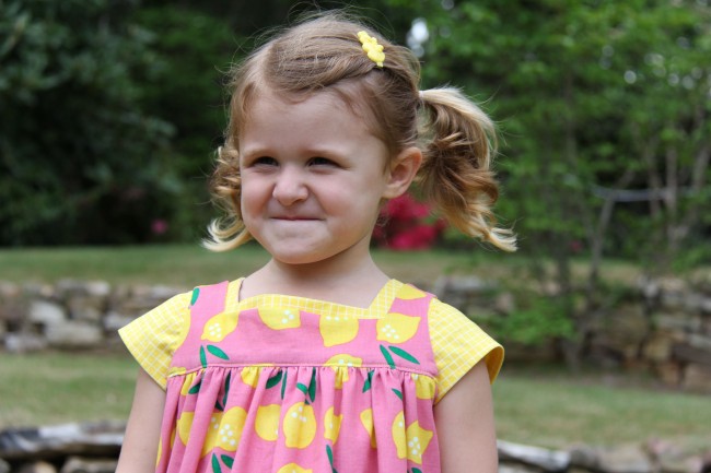 Small World corduroy makes little girls smile | Lemon Drop Pinafore by Whipstitch